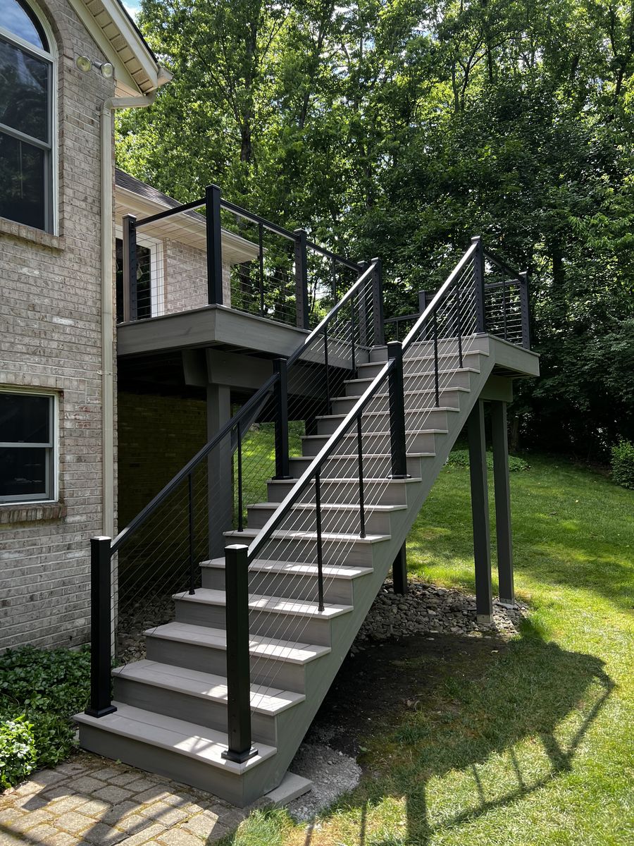 Finished deck stairs with cable railing