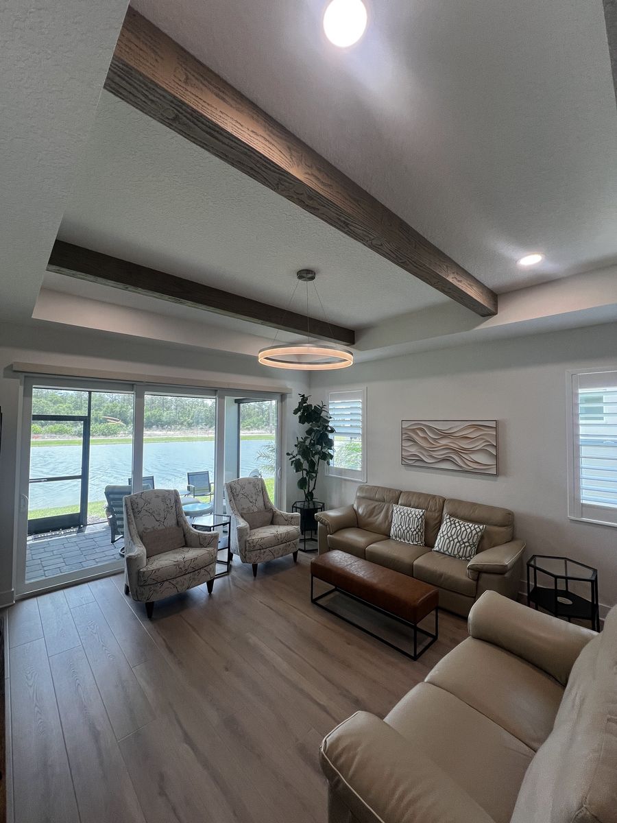 Living room remodel with decorative ceiling beams