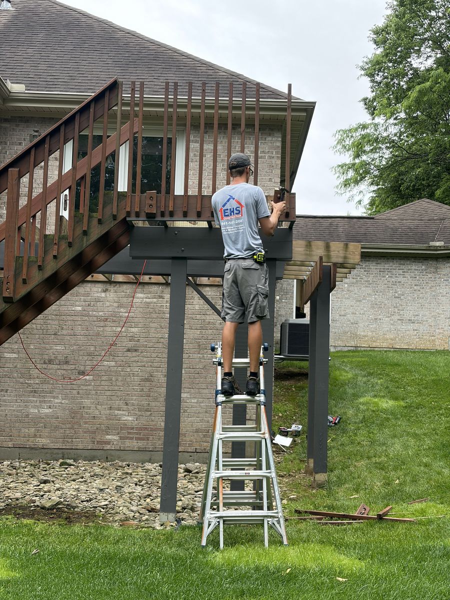 EHS Construction craftsman completing outdoor carpentry
